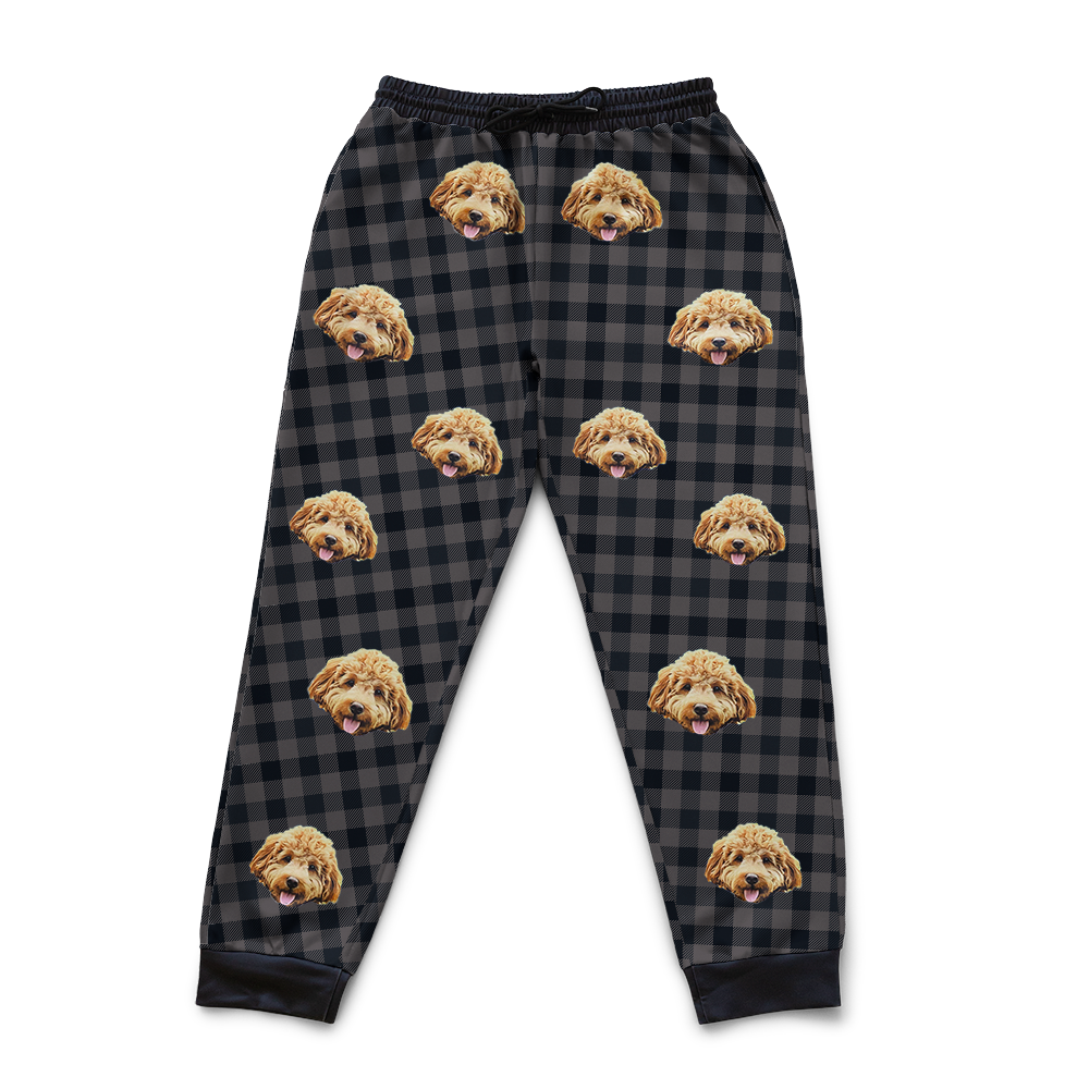 Black Charcoal Plaid pajama pants with dog face pattern on a white background