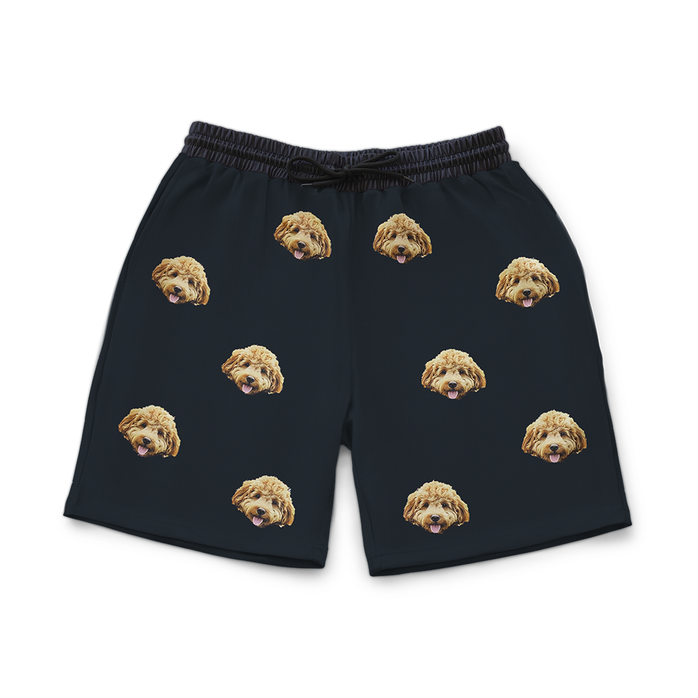 Black shorts with dog pattern on a white background