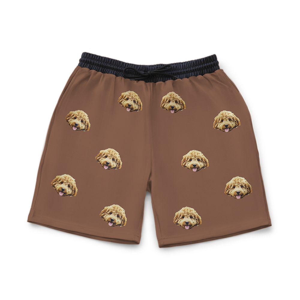 Brown shorts with dog pattern on a white background