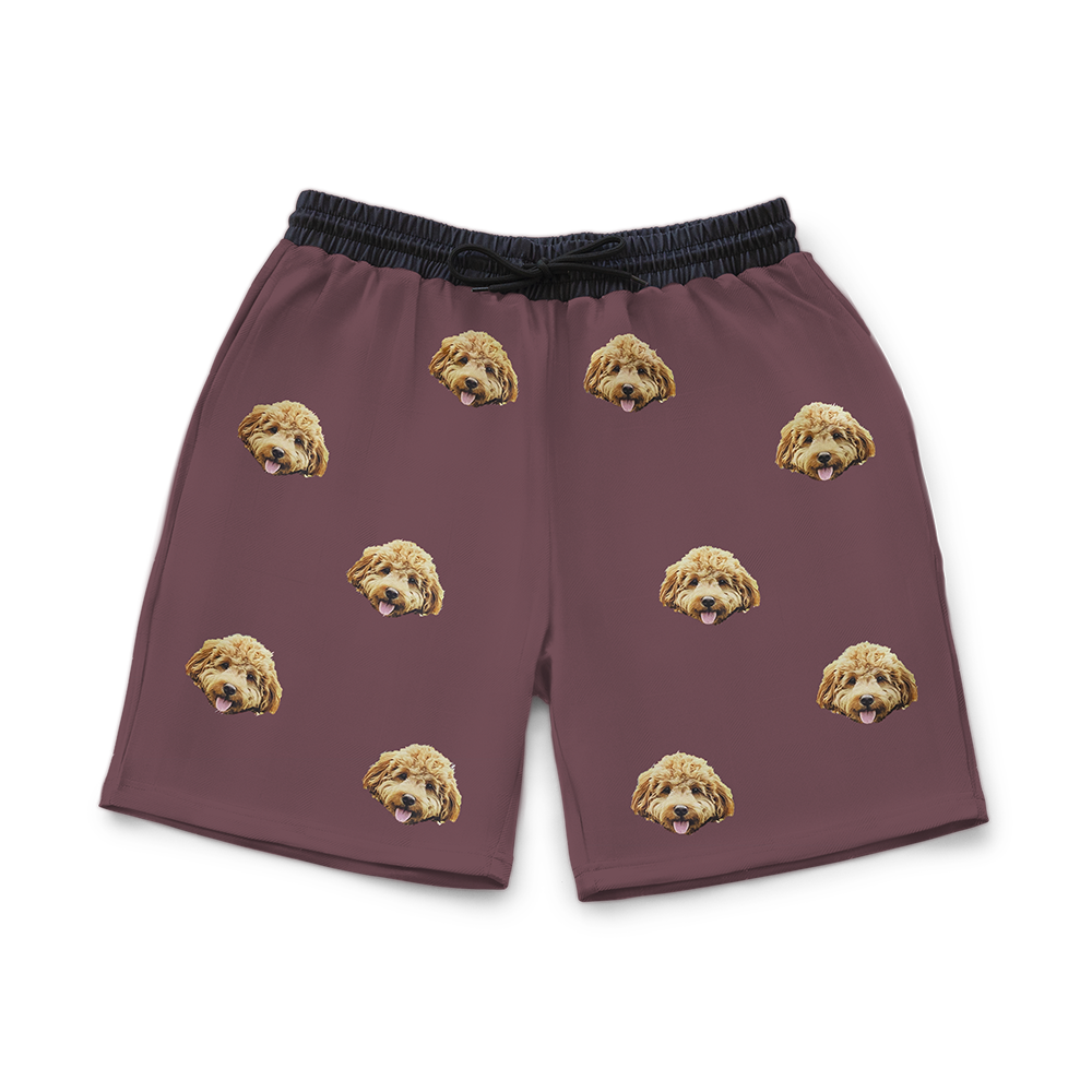 Maroon shorts with dog pattern on a white background