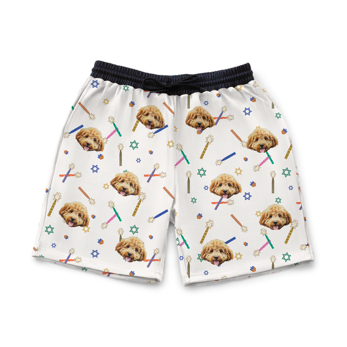 A pair of white sweatshorts with a repeating custom pattern. The pattern features several close-up photos of a light brown Goldendoodle's face, interspersed with graphics of colorful Hanukkah candles and wands, and small Stars of David.