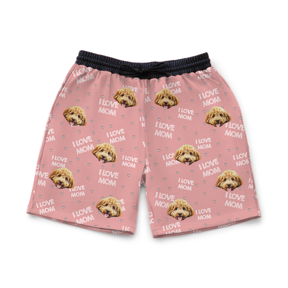 Pink shorts with dog pattern on a white background