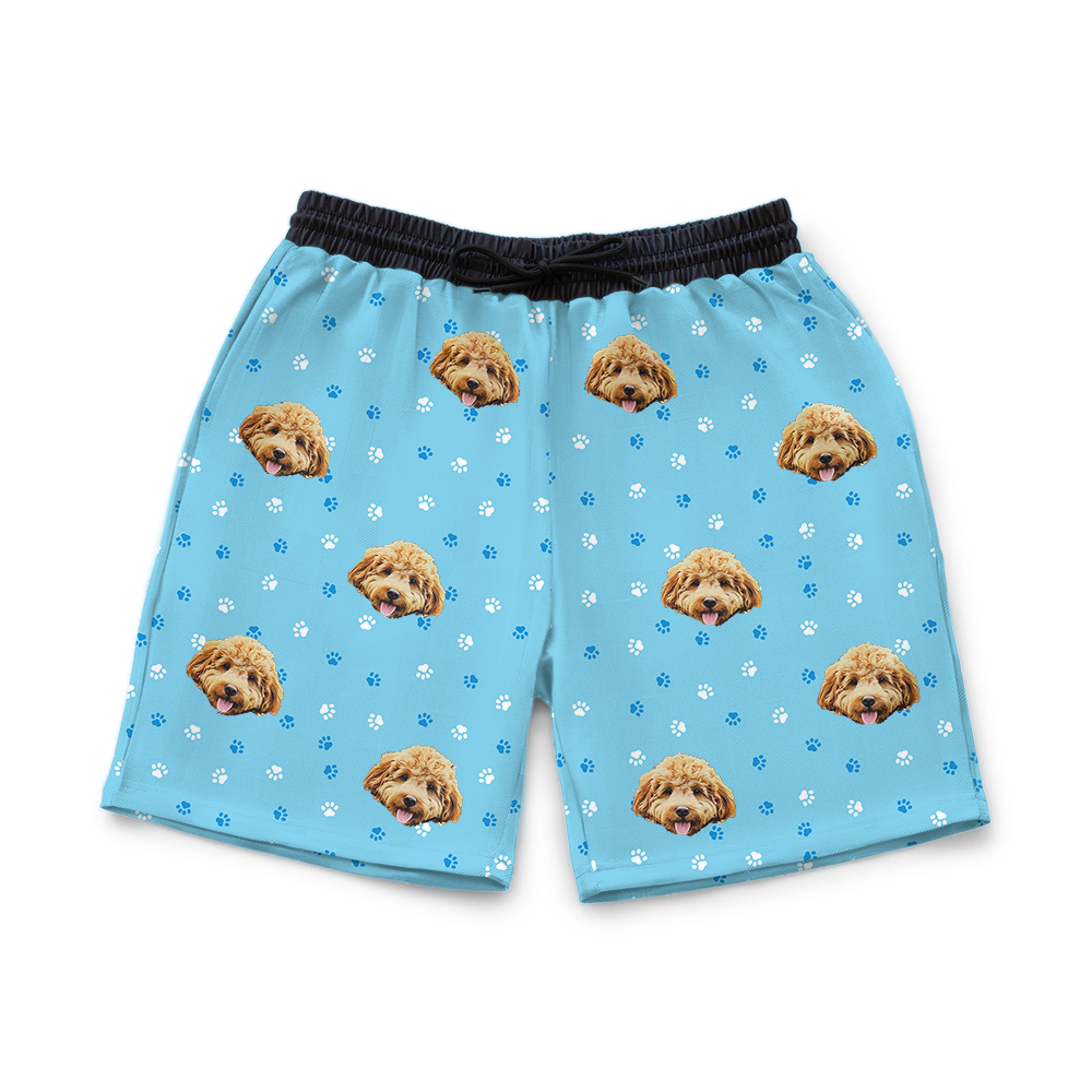 Light blue shorts with dog pattern on a white background