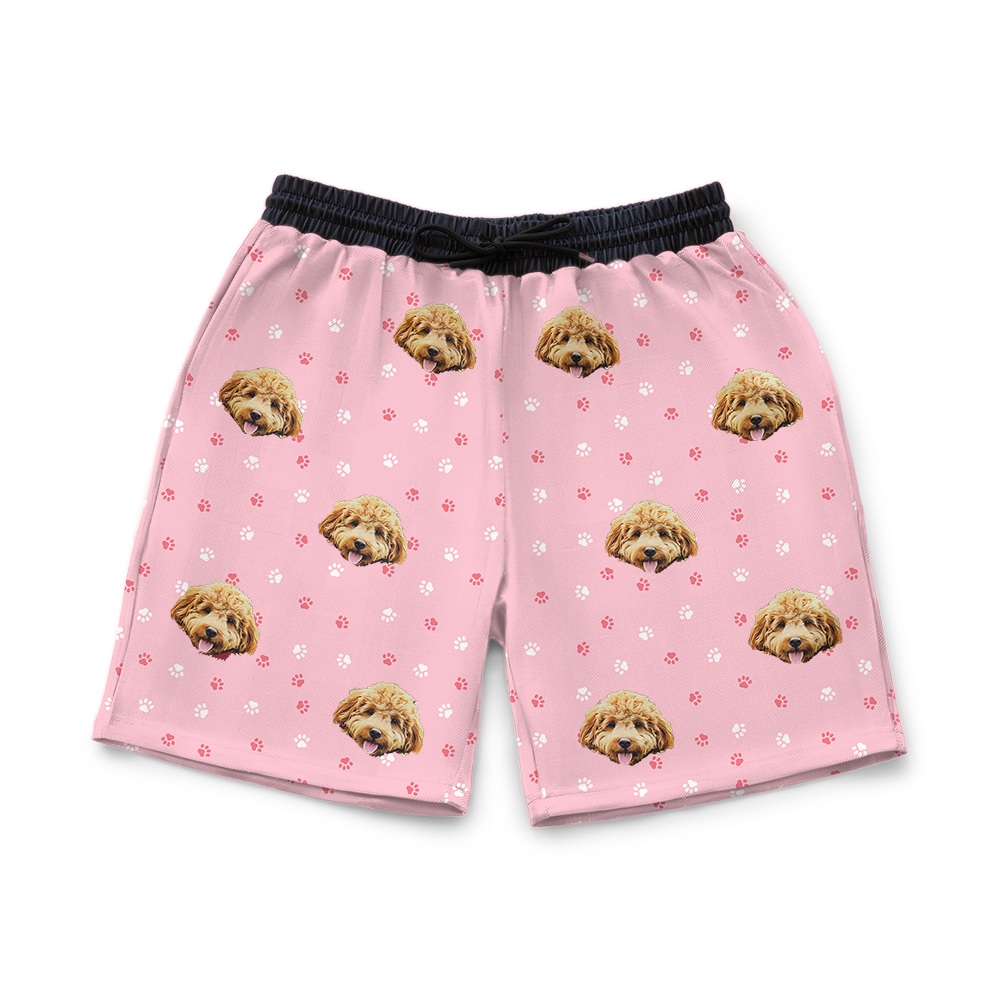 Light pink shorts with dog pattern on a white background
