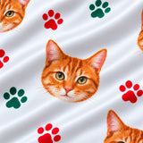 Close-up of the Christmas Paws print showing custom pet faces with red and green paw prints on a white fabric