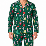 A man wearing a matching green long-sleeve pajama set with a festive Christmas print featuring Dalmatian dogs, Santa Claus, Christmas trees, and houses, shown against a plain white background.