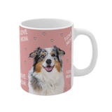 Pink ceramic mug with hearts and the phrase "I Love Mom", featuring a smiling, multicolored Australian Shepherd