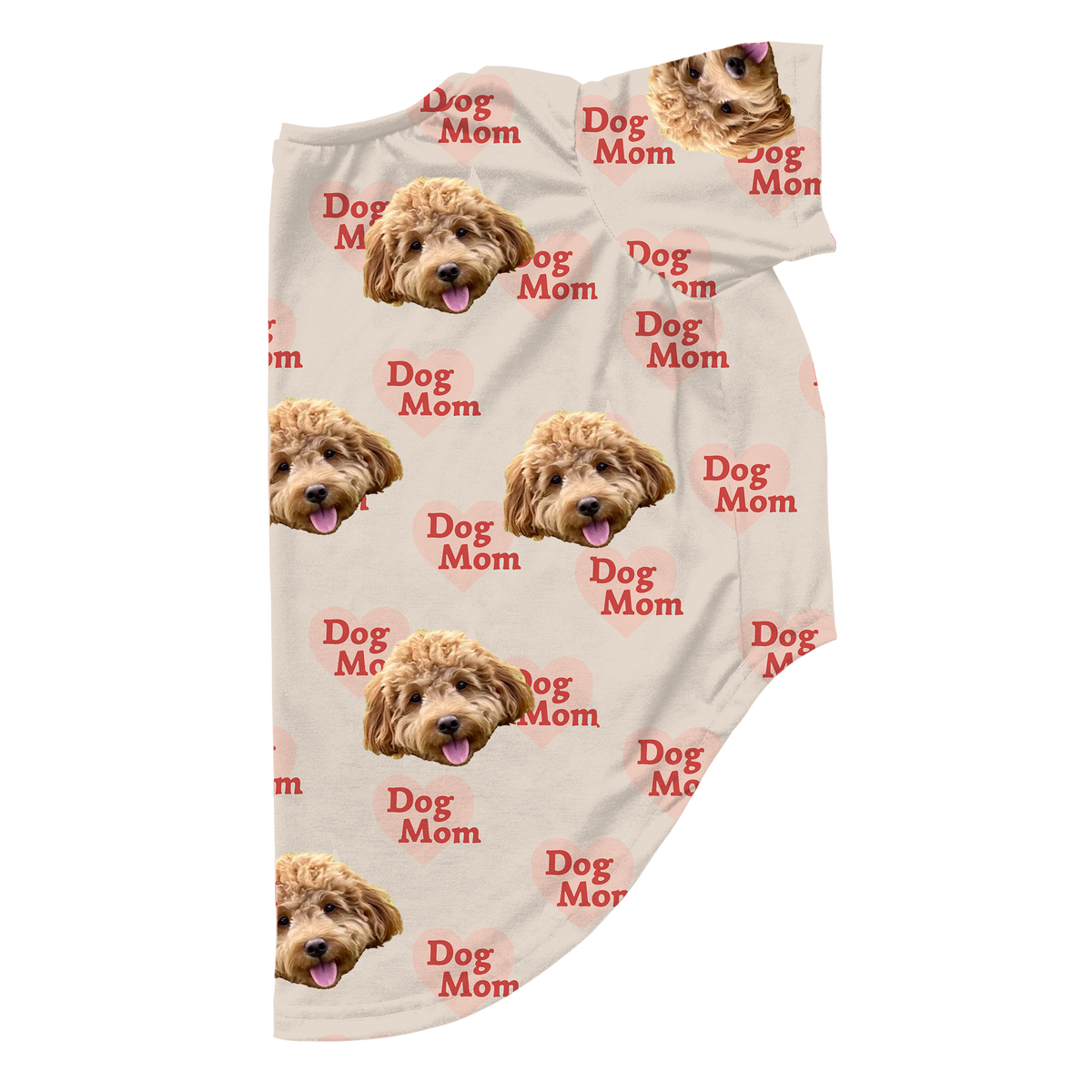 Personalized cream-colored dog pajamas with an all-over print of a fluffy dog’s face and red heart graphics that say “Dog Mom”.