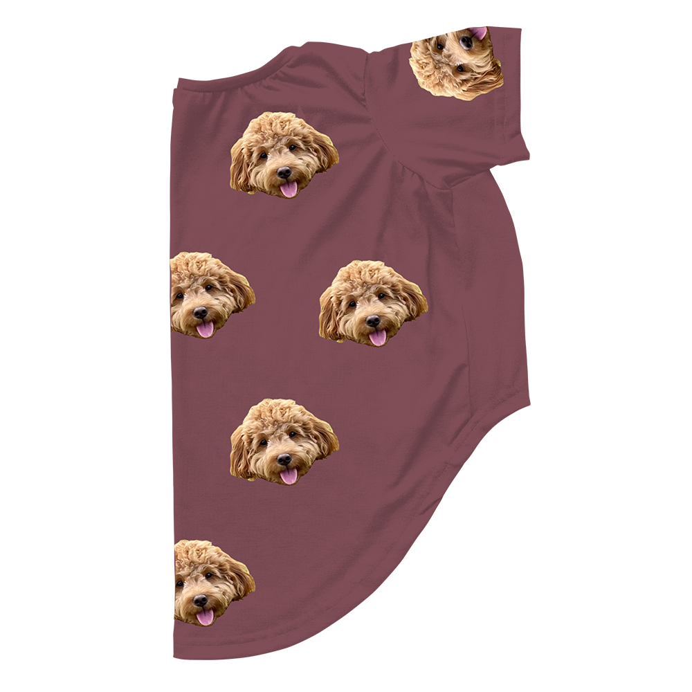 Maroon dog pajama with repeating pet faces on them