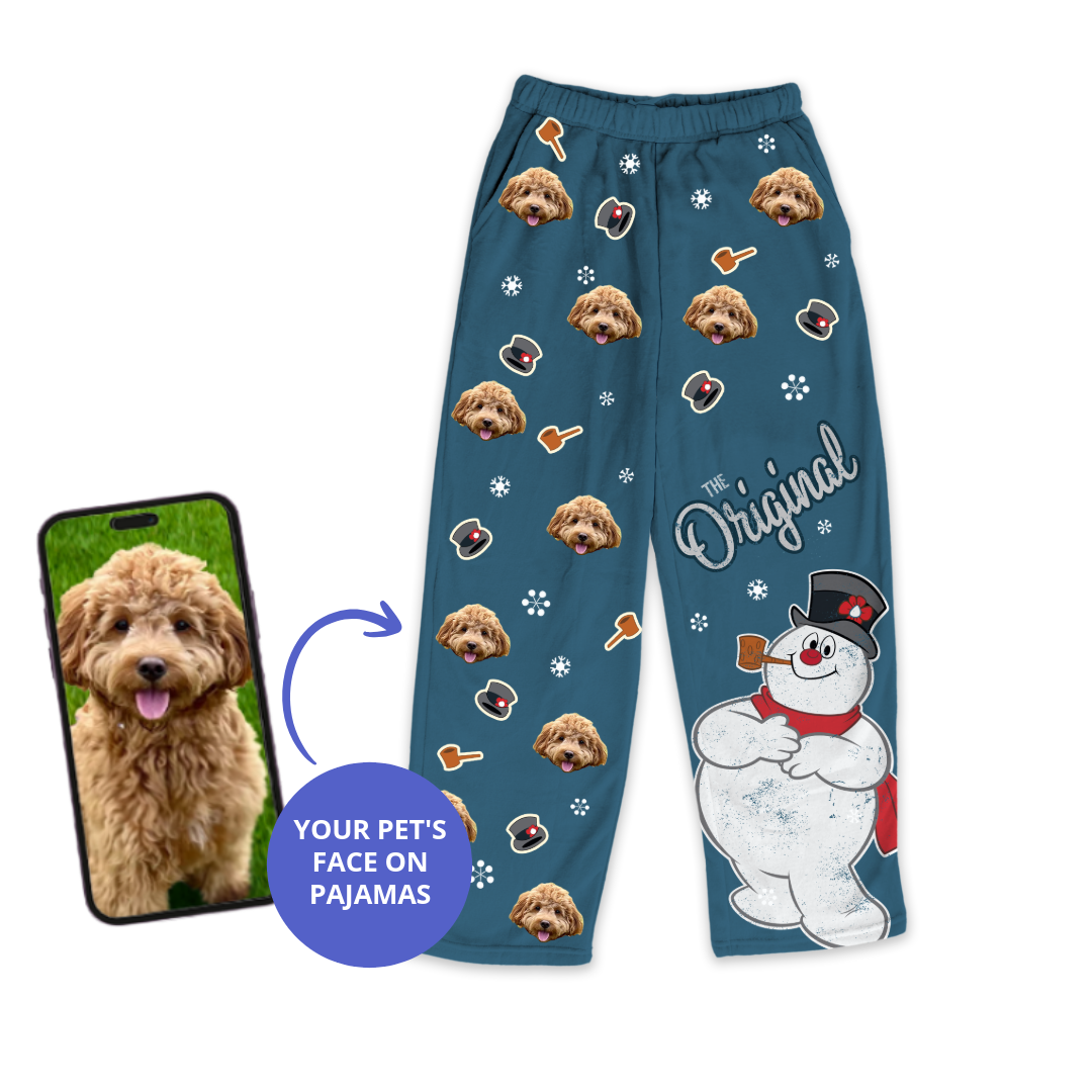 Blue pajama pants featuring a dog's face pattern with Frosty the Snowman design, shown next to a smartphone displaying the dog's photo.