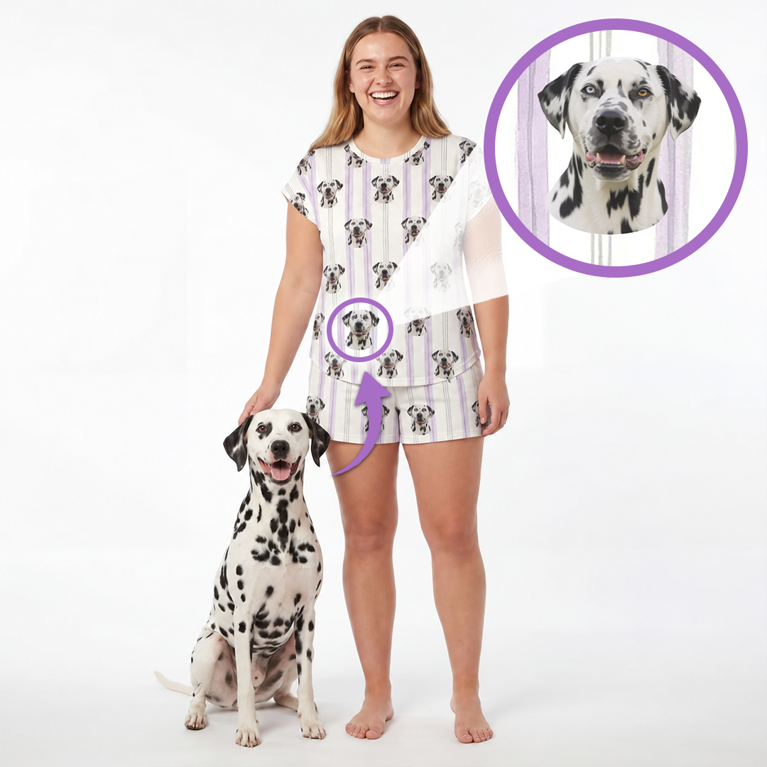 A woman stands barefoot next to a Dalmatian dog on a white studio background, wearing a matching sleepwear set printed with the dog's face. A circular inset at the top right shows a close-up of the dog's face, with purple arrows pointing to the print on the clothing.