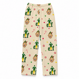A pair of fleece pajama pants in a warm cream color, featuring an all-over print of Buddy the Elf, candy canes, elves, and paw prints on a white background.