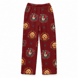 A pair of kids' fleece pants in a deep burgundy red, featuring an all-over print of golden retriever dog faces and circular portrait medallions with small teal and gold decorative accents.