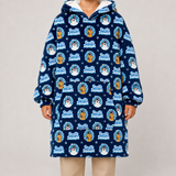 A person wearing a navy hooded sweatshirt with a repeating 'Frosty Snowman' winter-themed print, shown against a plain light gray studio background.