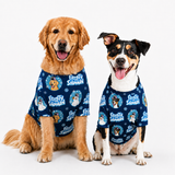 Two dogs wearing matching navy blue pet shirts with a 'Frozen Snowman' cartoon print, posed against a solid white studio background.