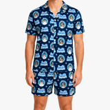 A man wearing a matching navy blue short-sleeve button-up shirt and shorts set with a repeating 'Frosty Snowman' dog print, shown against a plain white background.