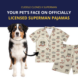 Dog with Superman pajamas featuring its face, branded as Cuddle Clones x Superman.