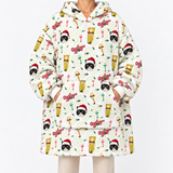 A person wearing a hooded sweatshirt with an all-over festive print featuring Grumpy Cat faces, Christmas hats, musical instruments, and red text on a white background.