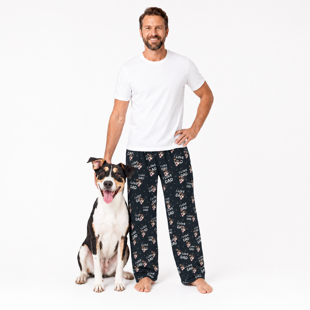 Man wearing a white t-shirt and black pajama pants with a dog on a white background