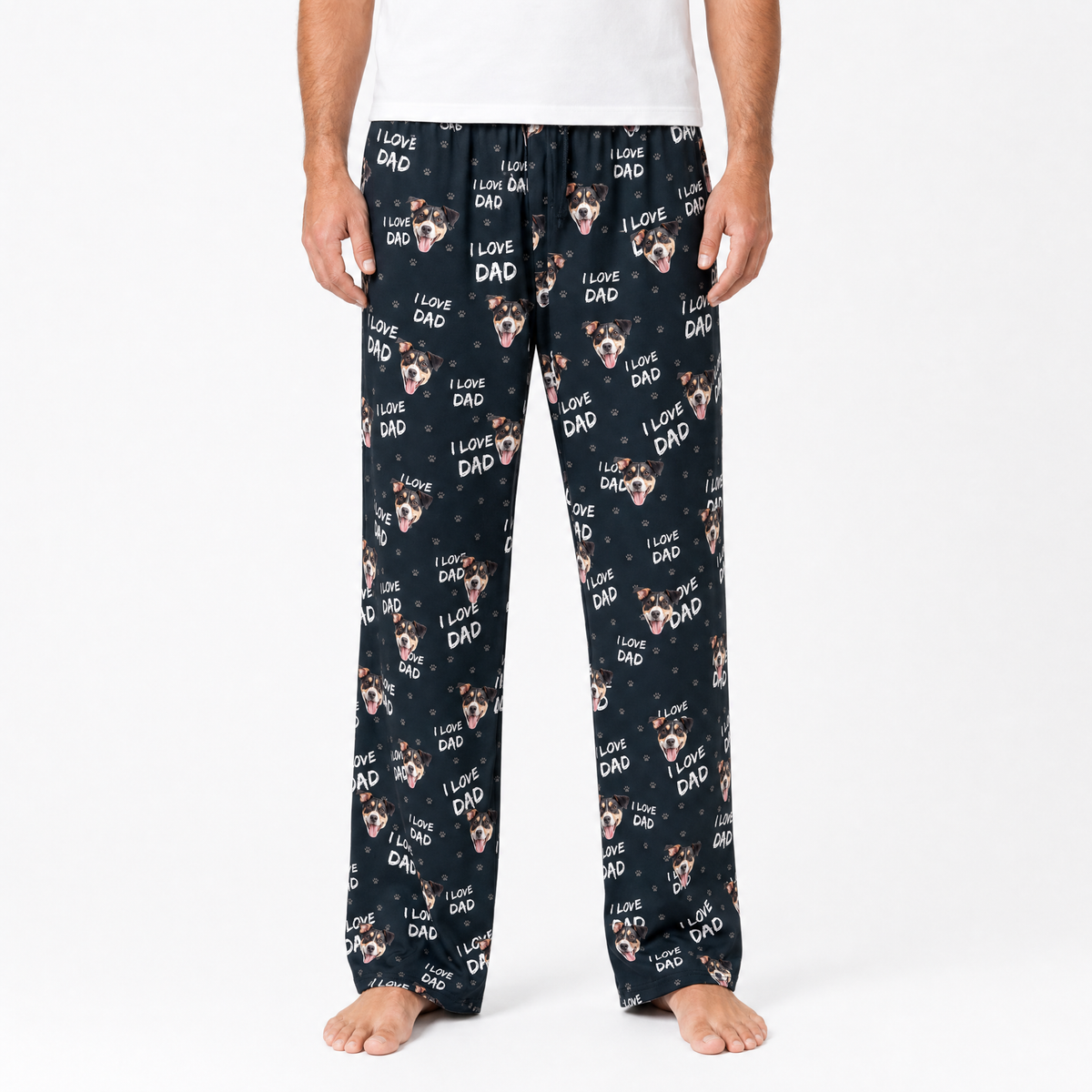 Person wearing black pajama pants with dog print and 'I love dad' text on a white background