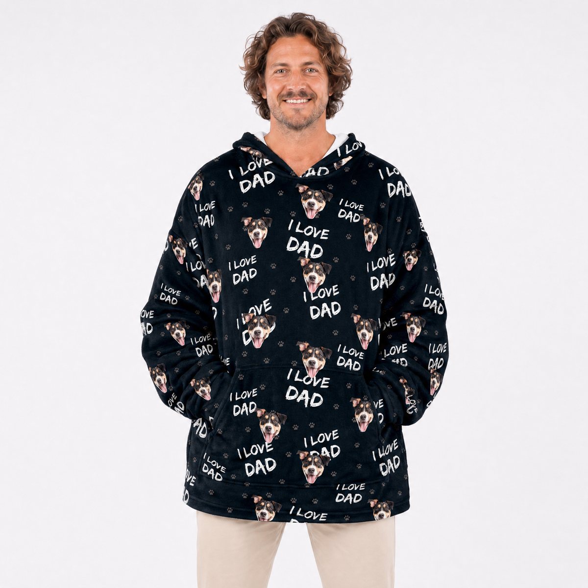 Person wearing a black blanket hoodie with 'I Love Dad' text and dog images on a white background