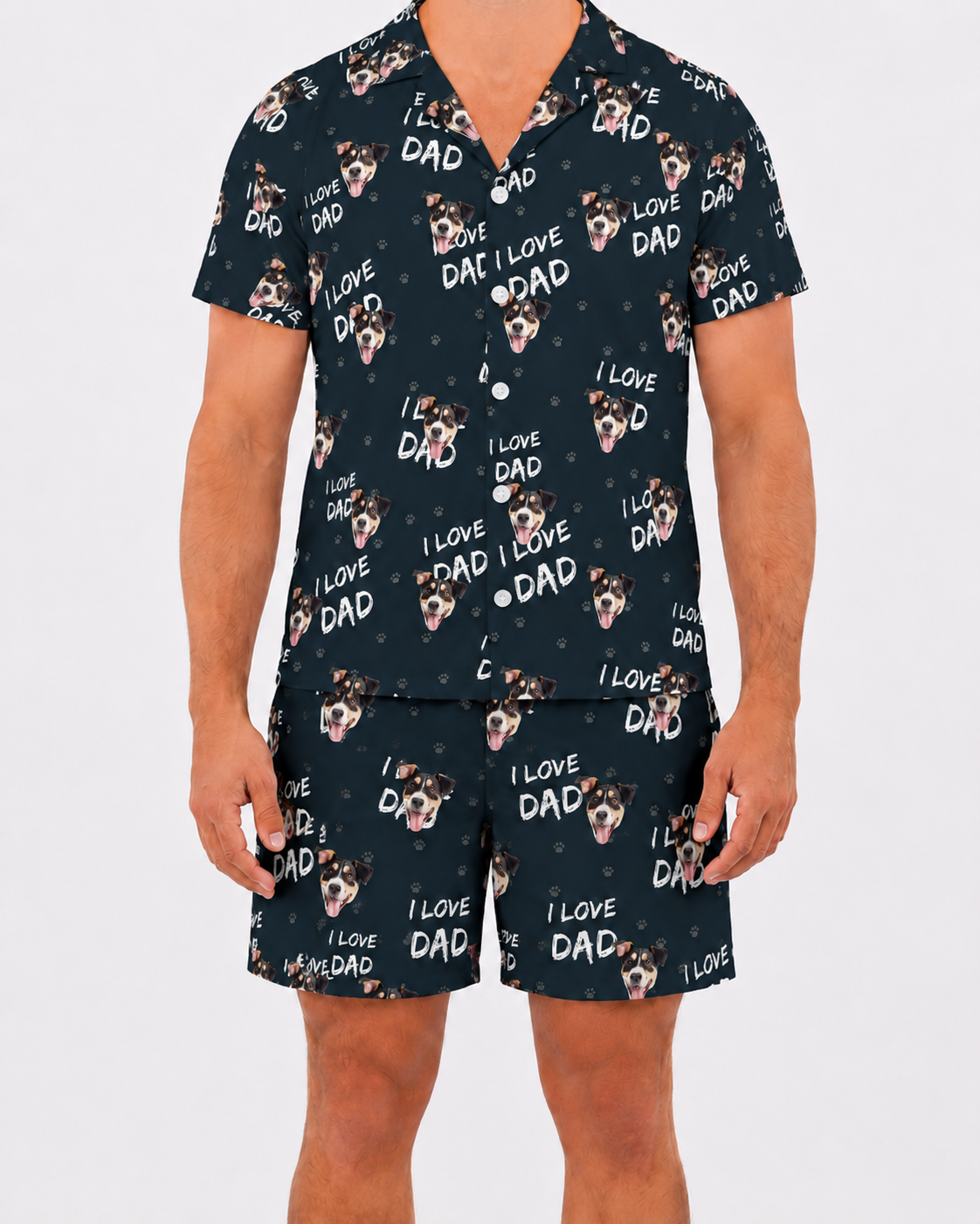 Person wearing a navy blue pajama set with 'I Love Dad' and dog pattern on a white background