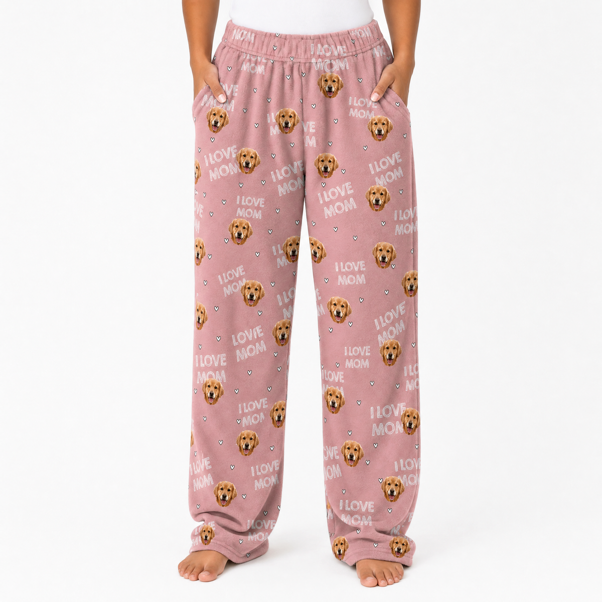 Pink pajama pants with dog pattern and 'I love mom' text on a white background