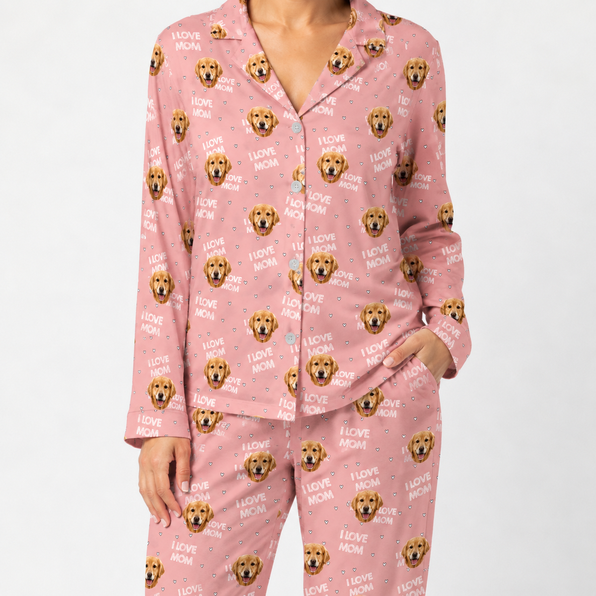 Pink pajama set with dog pattern on a white background