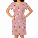 Pink nightgown with 'I Love Mom' and dog pattern worn by a person on a white background