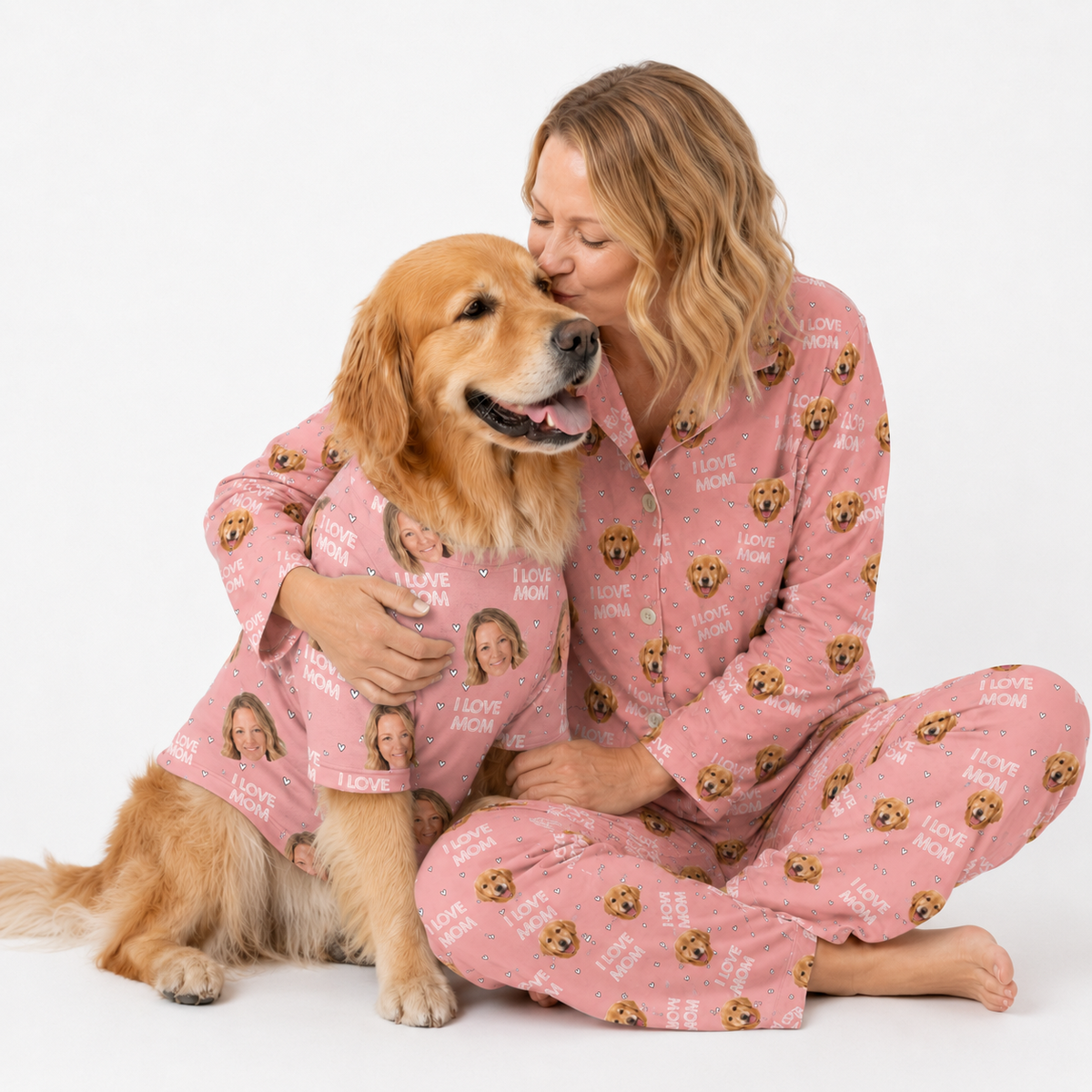 Woman and golden retriever wearing matching pink “I Love Mom” custom pet pajamas on a white studio background.
