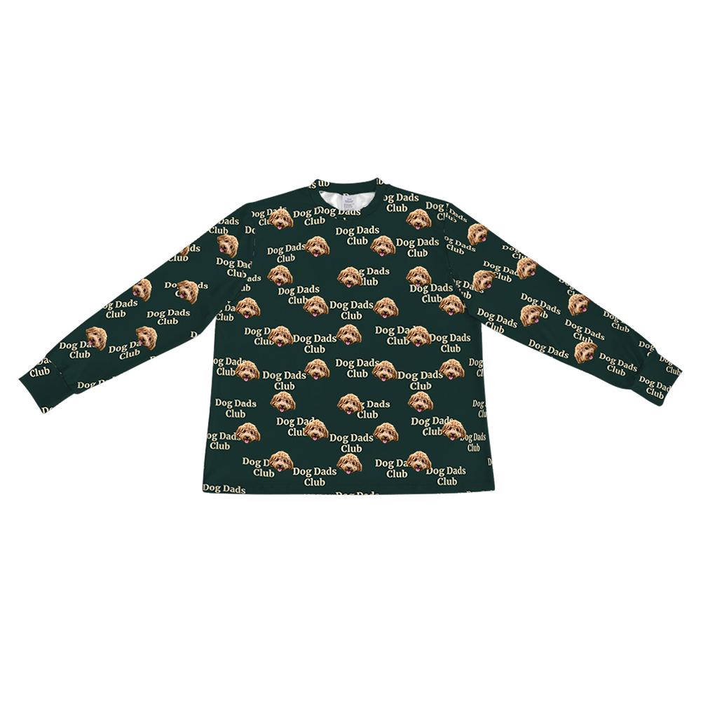 A dark hunter green long-sleeve pajama top with a crew neck. It features a repeating custom pattern of a light brown Goldendoodle's face, interspersed with the white text "Dog Dads Club" in a repeating diagonal pattern.