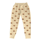 These are jogger pajama pants in a butter yellow color with repeating pet faces on them[ButterYellowJoggerPajamaPants]
