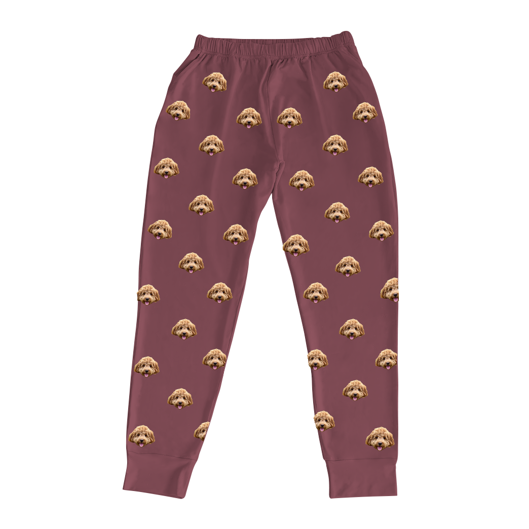 These are jogger pajama pants in a maroon color with repeating pet faces on them[JoggerPajamaPants]