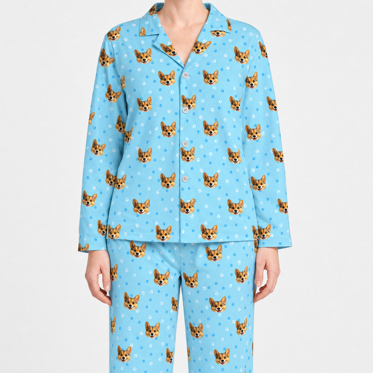 Light blue pajama set with dog pattern on a white background