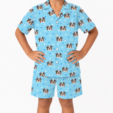 Children's light blue pajama set with dog pattern on a white background
