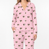 Pink pajama set with dog pattern on a white background