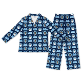 A two-piece kids' pajama set consisting of a long-sleeve collared top and matching pants, both in navy blue with a repeating pattern of cartoon dogs inside light blue circular frames and the text 'Just Dog'.