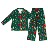 A two-piece pajama set featuring a long-sleeve button-up top and matching pants, both printed with a festive Christmas dog pattern on a dark green background.