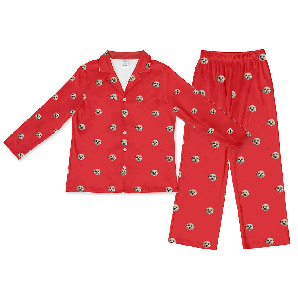 Matching red long-sleeve pajama set with a button-down top and pants, patterned with the custom photo head of a single, light-colored dog.