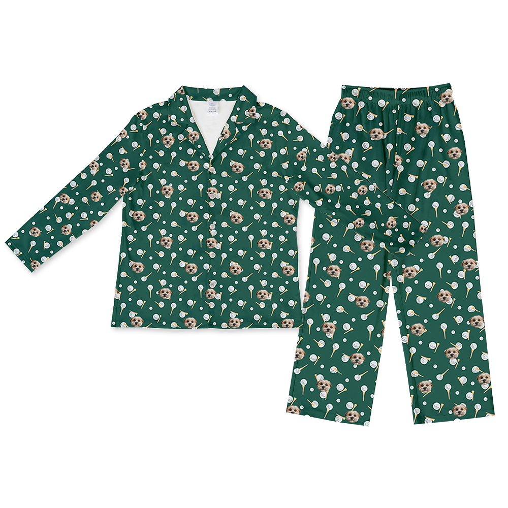 Green two-piece pajama set with a long-sleeve button-down top and matching pants, featuring an all-over pattern of small dog faces, golf balls, and golf tees.