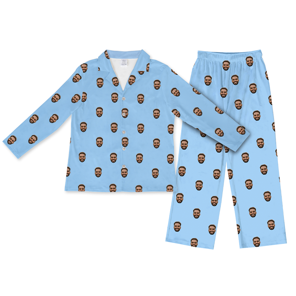 Light blue long-sleeve button-up pajama top with matching pants, featuring a repeating pattern of the same smiling man’s face printed across the fabric.