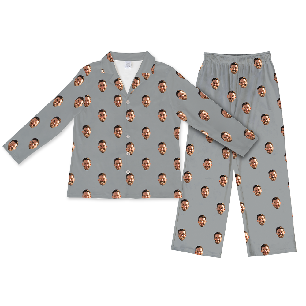 Slate-gray long-sleeve button-up pajama top with matching pants, decorated with a repeating pattern of the same smiling man’s face across the fabric.