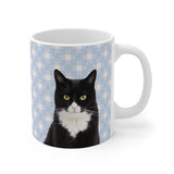 Custom 11oz ceramic mug with a tuxedo cat photo cutout portrait on a light blue gingham background with white snowflakes[SnowyGinghamImageCutOut]