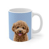 Custom 11oz ceramic mug with a curly goldendoodle hand illustration portrait on a light blue background with tiny white snowflakes[SnowflakesHandIllustration]