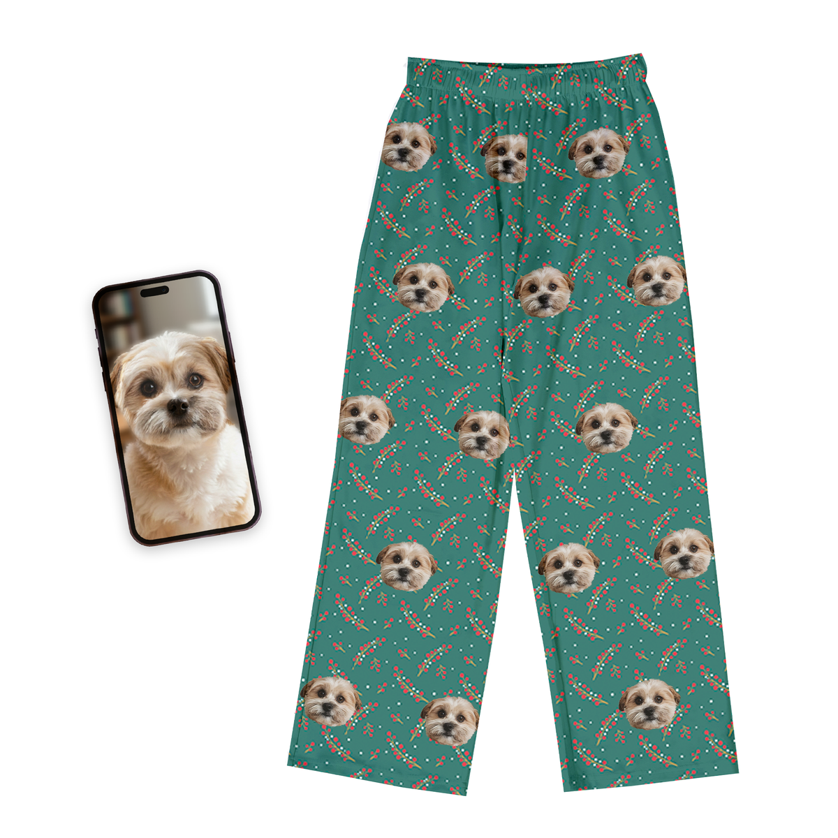 Teal pajama pants with dog pattern next to a phone displaying a dog photo on a white background