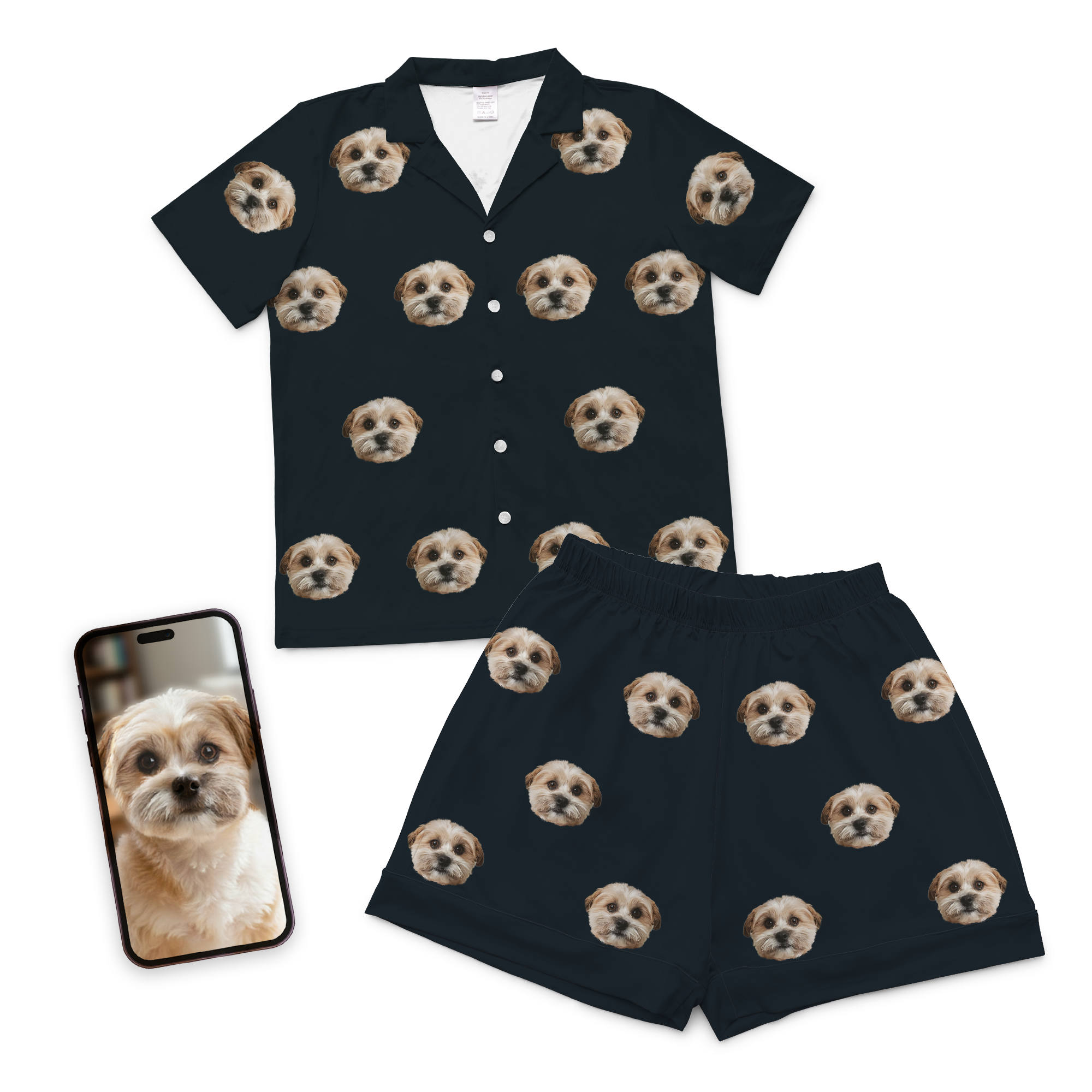 Custom pet face pajamas in black short button-down set with repeating dog portraits, shown with phone displaying original dog photo