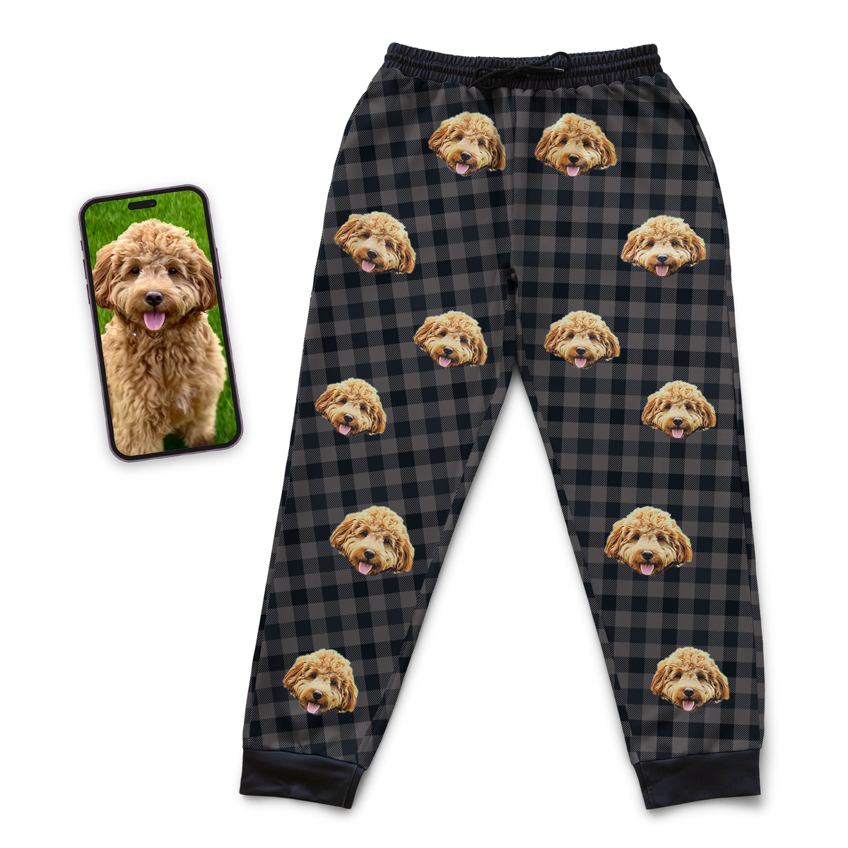 Black and dark grey plaid jogger sweatpants featuring a repeating custom dog face pattern, shown next to a smartphone displaying the dog’s photo.