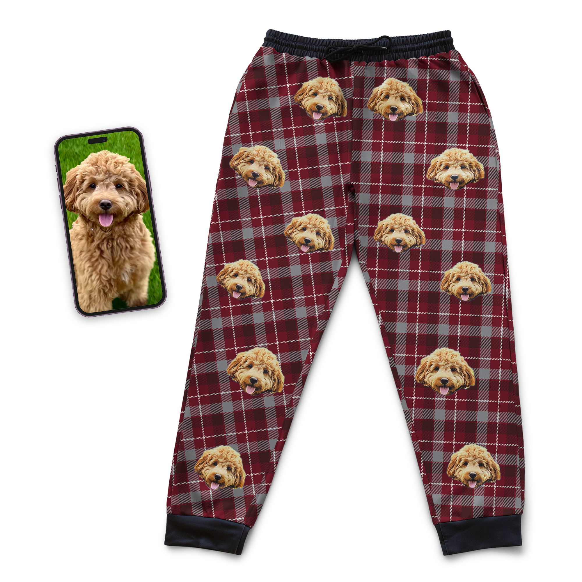 Red and grey plaid jogger sweatpants featuring a repeating custom dog face pattern, displayed next to a smartphone showing the reference dog photo.