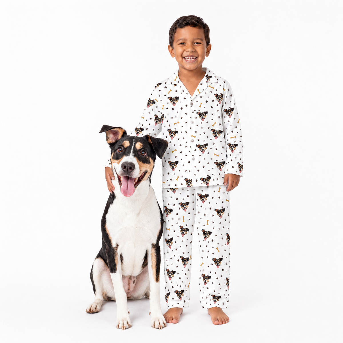 Child wearing a white patterned pajama set with a dog on a white background