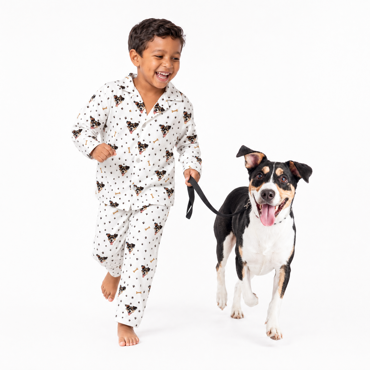 Child in white pajamas with a dog on a white background